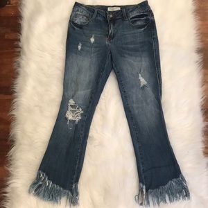 Dark wash mid rise distress jeans